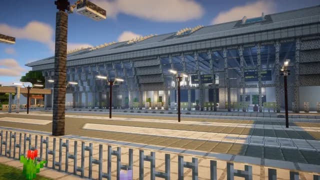 Le terminal de l’aéroport de Montello City, sa longue façade vitrée et la file de palmiers devant
