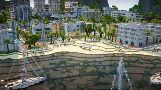 La plage de Montello City vue du ciel, ses parasols alignés et le front de mer bâti juste derrière